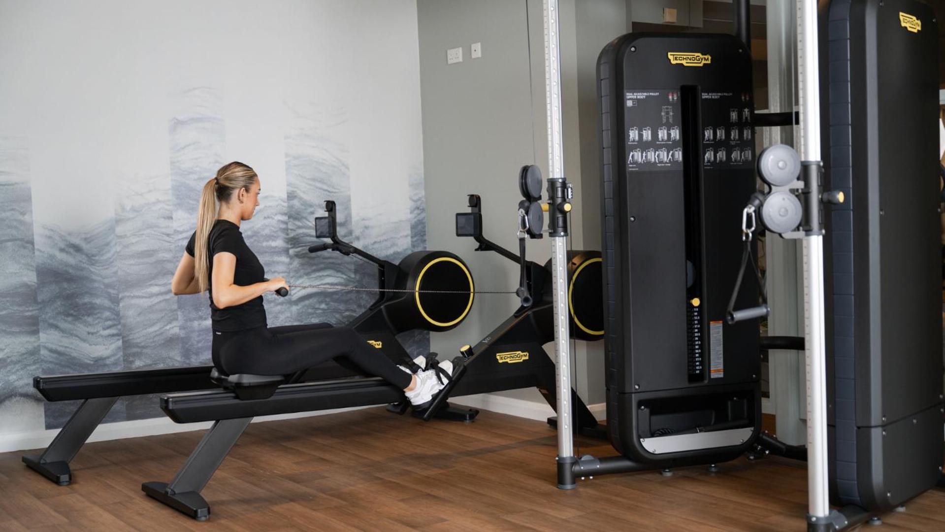 The Culloden Estate And Spa Holywood  Exteriér fotografie A woman using a rowing machine